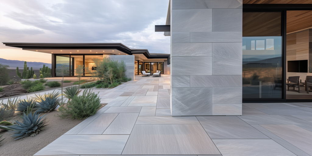 Pale large-format pavers around a modern desert home with agave and native plantings