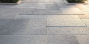 Close-up of rectangular natural stone paving laid in a repeating pattern