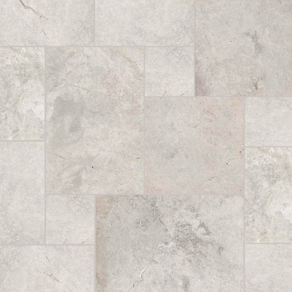 Summit Gray Marble pavers in soft gray tones laid in a pattern of mixed sizes